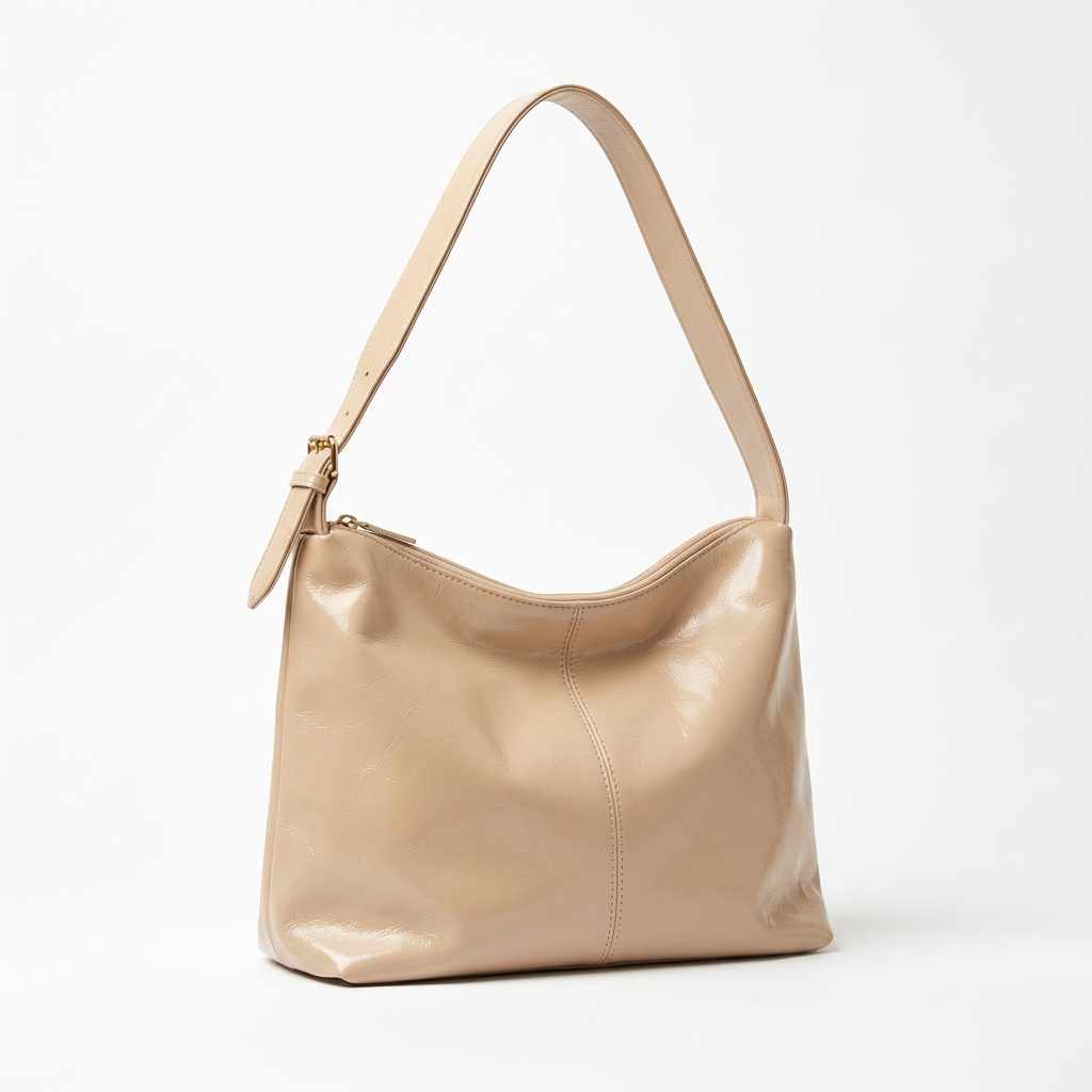 Light-beige shoulder bag on a white studio background