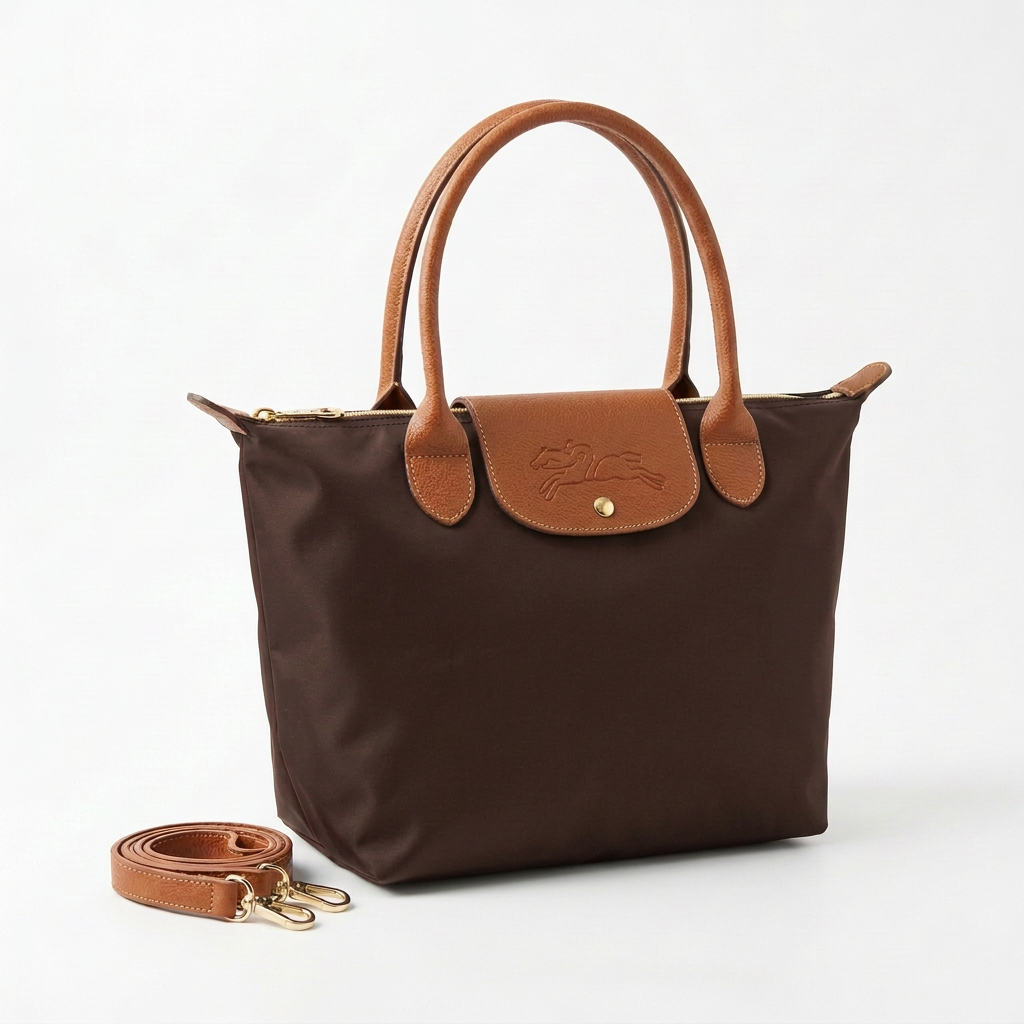 Dark-brown large bag with tan handles and strap neatly placed beside it on a white background